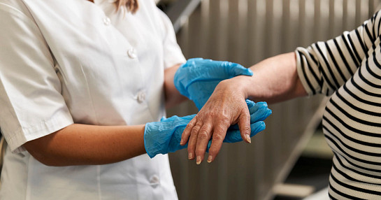 Nurse administering dermatology trial treatment