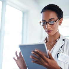 Physician utilizing digital health tools