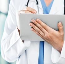 Doctor reviewing digital health data