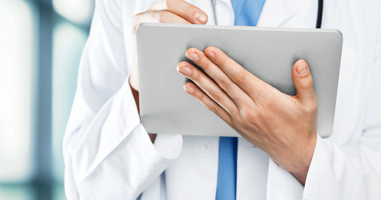 Doctor reviewing digital health data