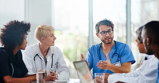 Hepatologists discussing liver treatments