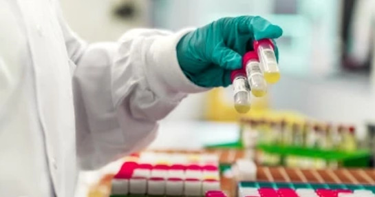 Researchers working in early phase clinical trial facility