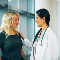 Female physician examining patient