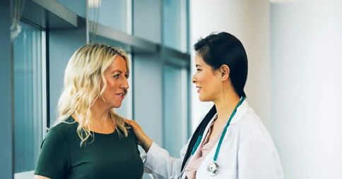 Female physician examining patient