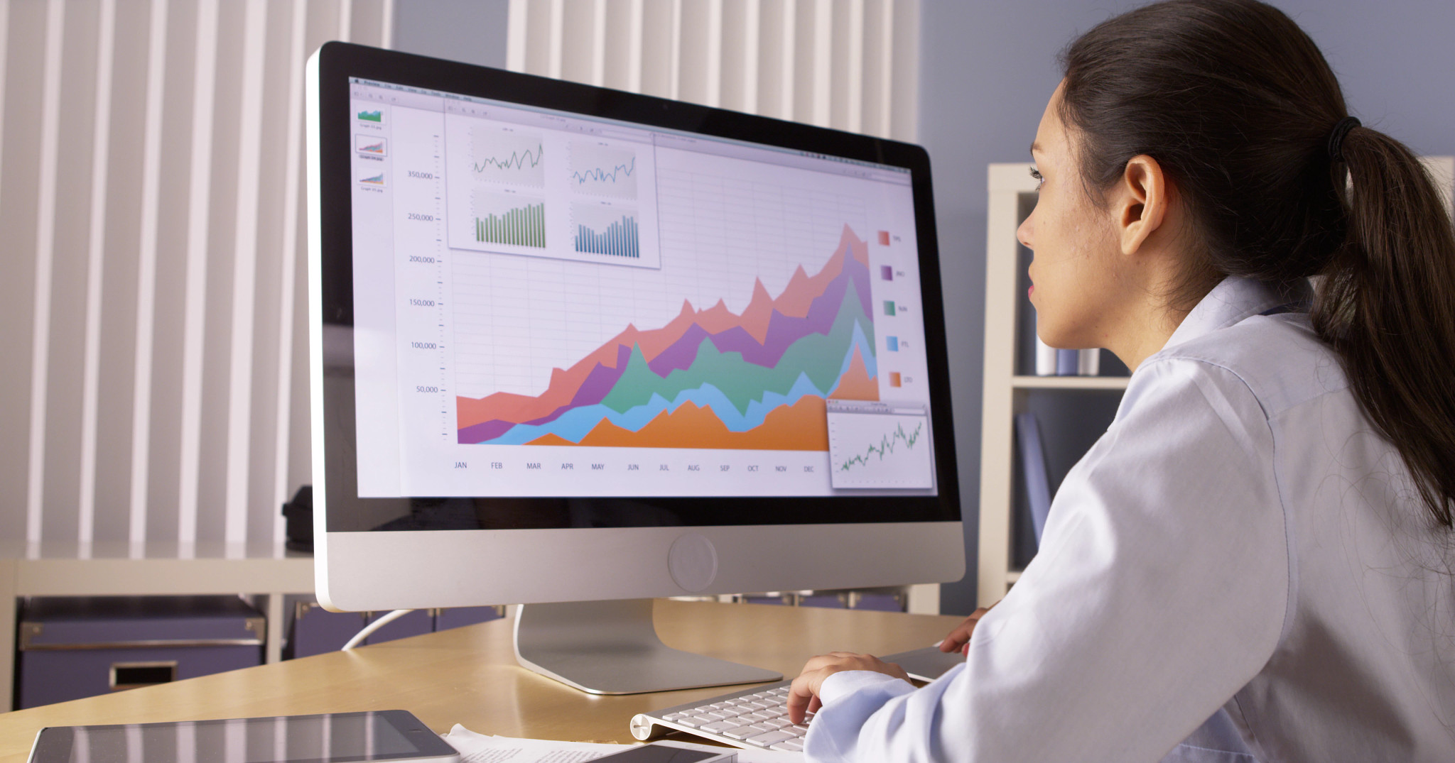Researcher analyzing blended solutions data