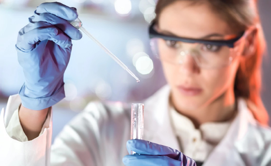 woman working with sample and test tube