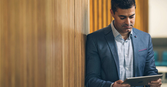 Researcher using tablet for assessments