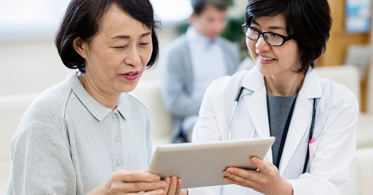 doctors looking at tablet