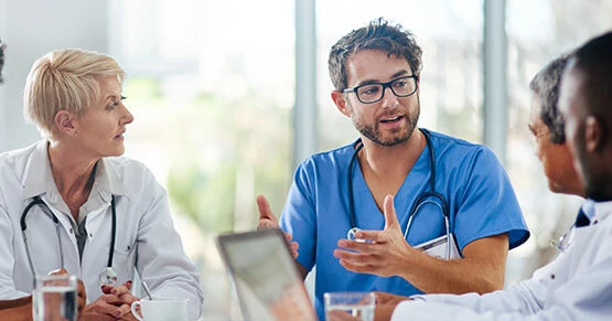 Doctors discussing patient data