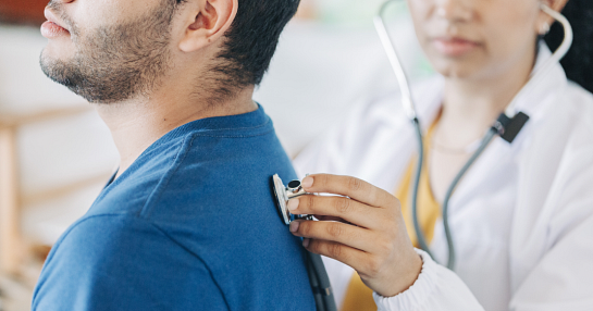 doctor with stethoscope and patient